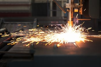 Industrial CNC Plasma Cutter Cutting a Piece of Steel
