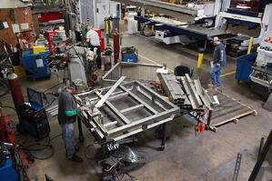 Marlin Steel employees hard a work building custom metal forms for customers.