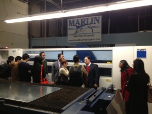 Marlin Steel President Drew Greenblatt describes the automation of sheet metal cutting to master's degree students from Johns Hopkins University Carey Business School