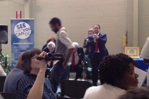 Marlin Steel President Drew Greenblatt applauds Edrick Smith, a Marlin employee, during graduation processional at Magna Baltimore Technical Training Center