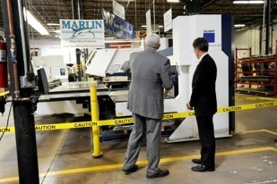 Dr. Greenblatt shows Treasury Secretary Geithner Marlin's new Laser Cutter