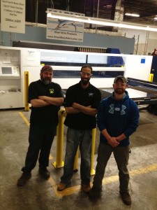 Three Marlin Steel employees in front of Marlin Steel's Trumpf laser