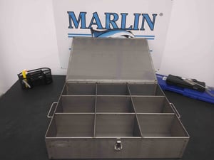 This perforated sheet metal basket was given dividers and a lid to help optimize it for small aircraft parts.