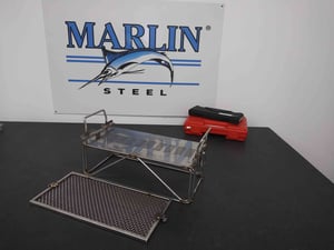 This is one of several automotive baskets that was made to accommodate the client's wide variety of parts. The slotted sheet metal portion would hold parts vertically during the wash, while the mesh lid would keep parts from sliding out.