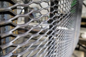 Expanded metal may resemble wire mesh from a distance, but a close-up look shows that it is a single, solid piece of material.