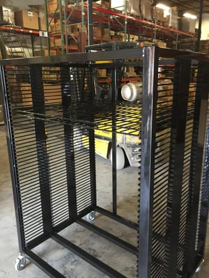 This mobile cart design has tightly-spaced racks, but is still open enough to aid in drying out parts.