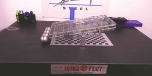 This basket's floats help tilt the basket automatically during the ultrasonic cleaning process.