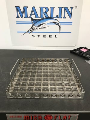 This custom parts washing basket uses numerous sheet metal dividers to keep delicate parts separated in harsh washing processes.