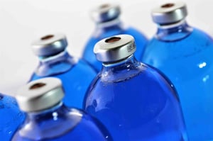 Medicine Bottles with Blue Liquid