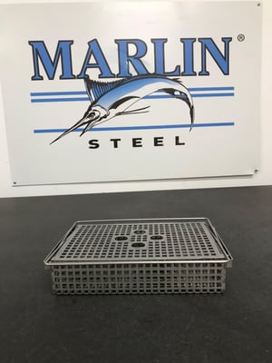 A stainless steel sheet metal basket for holding medical cassettes through a rigorous sterilization process.