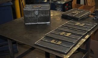 Wire Mesh Basket Components Laying on Workbench After Welding