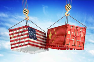 Two shipping containers in the colors of the American and Chinese flags crashing together.