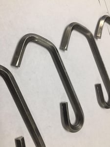 Diamond wire hooks can be a bit more difficult to shape than rounded wires because the angle of the wire as it passes through a machine matters more.