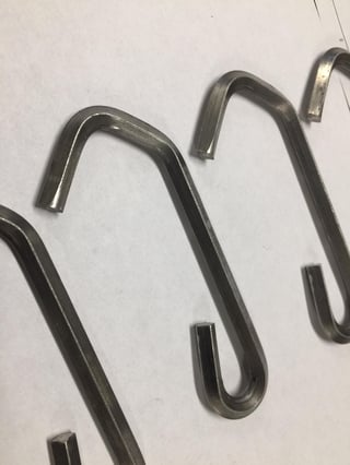Keeping the edges on an inside bend sharp is one of the biggest challenges for diamond wire hooks.