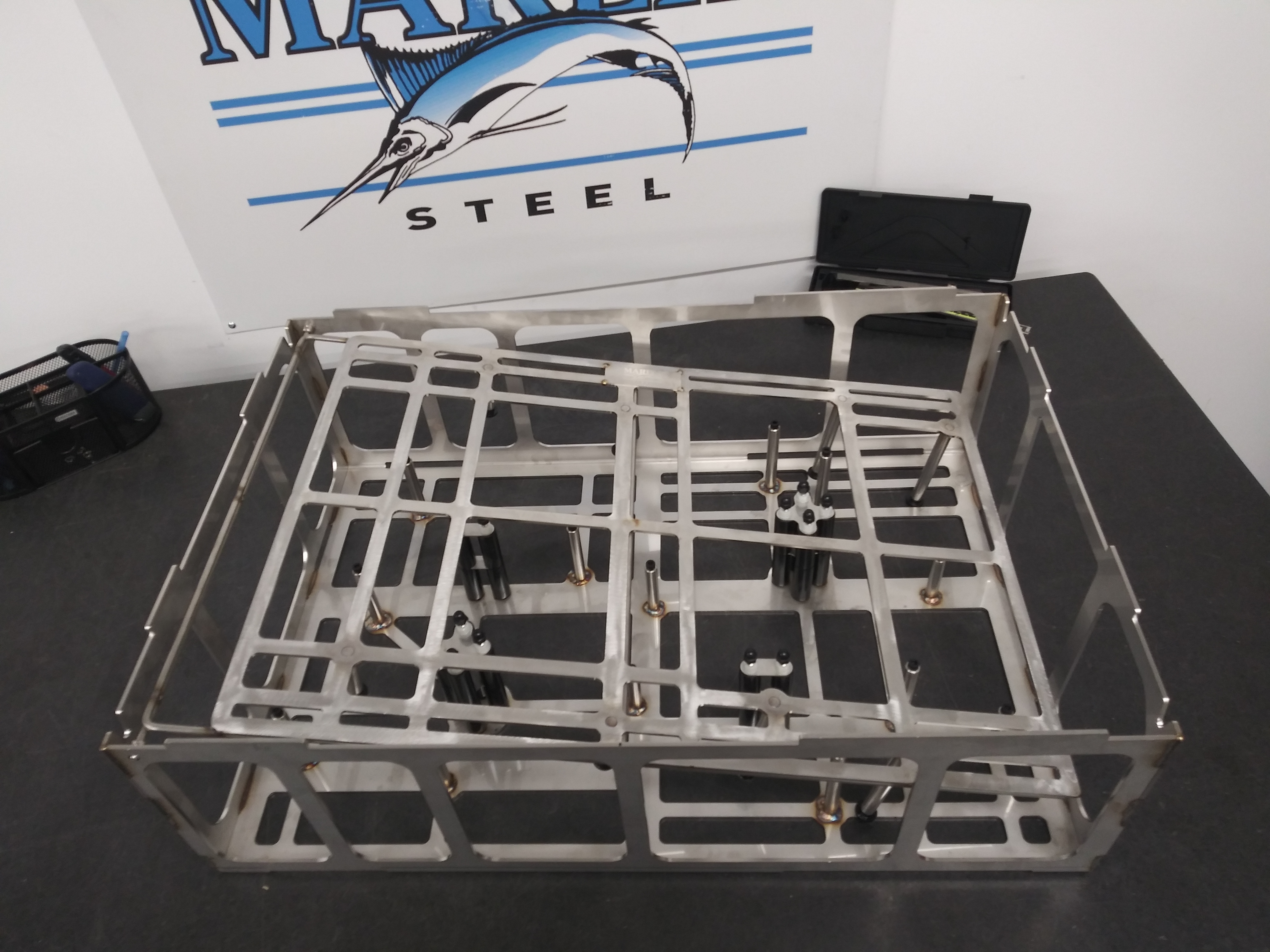 The Marlin Steel Solution: Custom Stainless Steel Machined Automotive Component Basket Applications